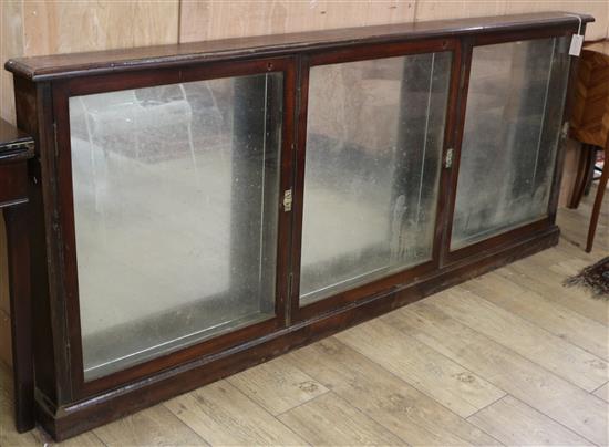 A 19th century mahogany shop display cabinet W.205cm